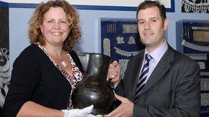Det Insp Martin Peters handing back the Wenlock Jug to Karen Perkins