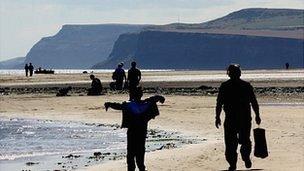 People walking on Redcar beach