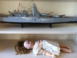 A child's doll and a model battleship in the former residence of President Giscard d'Estaing