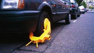 A wheel clamped car