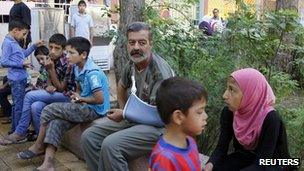 Displaced Syrians living in a school in Damascus after fleeing the violence in their home towns