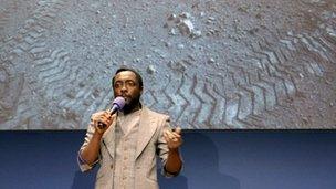 Will.i.am singing at Nasa's lab