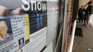 A sign showing a sample photo ID in Butler, Pennsylvania 26 September 2012