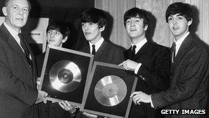 The Beatles being presented with gold discs