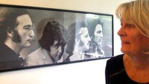 Pat Clark with a picture of The Beatles