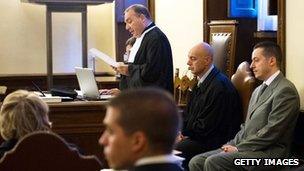 Former Pope Benedict XVI's butler Paolo Gabriele (R) attends the opening session of his trial at the Vatican Courthouse on September 29, 2012 in Vatican City