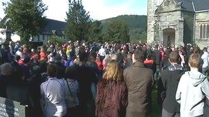 Hundreds stood outside the church