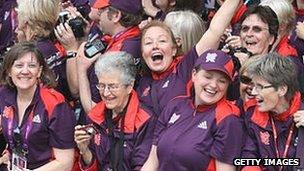 Volunteers during the London 2012 Victory Parade for Team GB and Paralympic GB athletes