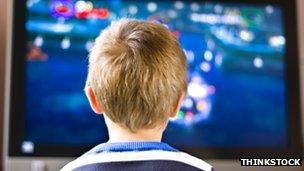 Boy in front of screen