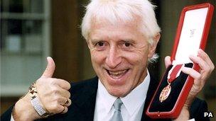 Sir Jimmy Savile after receiving his knighthood in 1996