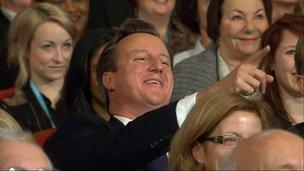 David Cameron laughs and points during Boris Johnson's speech