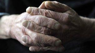 The hands of an elderly man