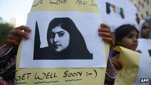 Pakistani demonstrators carry photographs of gunshot victim and child activist Malala Yousafzai. File pic: 11/10/2012