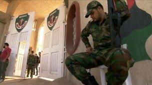 Guard at entrance to al-Judaida prison