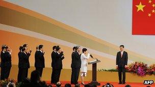 Hong Kong Chief Executive Leung Chun-ying (R) watches his cabinet members as they are sworn in during an inauguration ceremony in Hong Kong, 01 Jul 2012