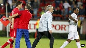 Serbian player Milos Ninkovic, left, and England player Danny Rose, right, react during their 2013 UEFA European Under-21 Championship play-off