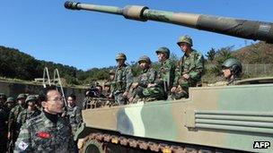 South Korean President Lee Myung-Bak (L) talking with marines at Yeonpyeong Island, 18 October 2012