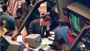 19 October 1987. A trader holding his head at the floor of the New York Stock Exchange when the Dow Jones dropped over 500 points, the largest decline in modern time, as panic selling swept Wall Street.