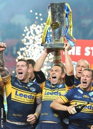 Kevin Sinfield (centre) lifts aloft the Super League trophy