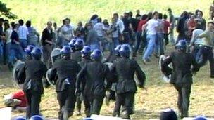 Striking miners and police in riot gear