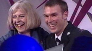 PC Stypulkowski receives his award from Home Secretary Theresa May