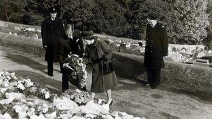 queen and duke of edinburgh leave floral tribute at memorial site