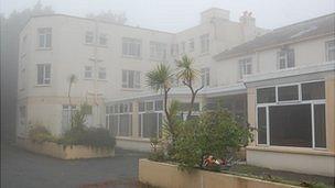 Former St Martin's Hotel in Guernsey, surrounded by mist