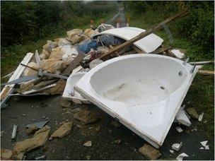 flytipped waste in road