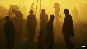 Pakistanis at a livestock market near Islamabad