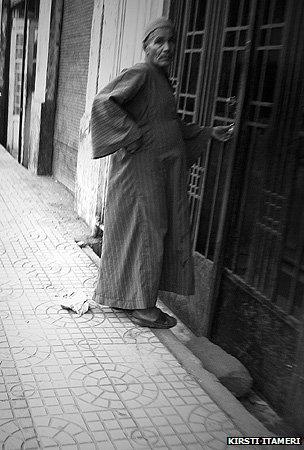A doorman going into a building in Cairo