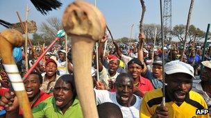 September 2012 file picture of thousands of miners of South Africa's strike-hit platinum industry at a rally in Rustenburg