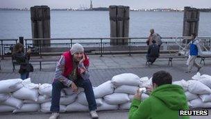 Visitors with the Statue of Liberty in the background, 29 Oct