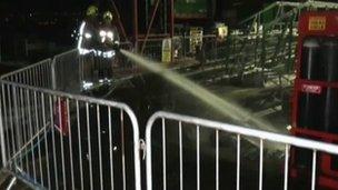 Firefighters tackling the blaze at Mumbles pier