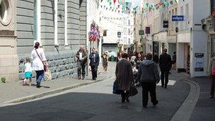 Shops and shoppers in Le Pollet in St Peter Port, Guernsey