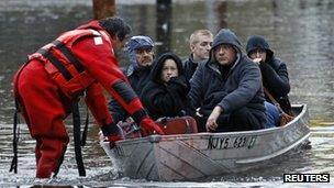 People in a boat (Image: Reuters)