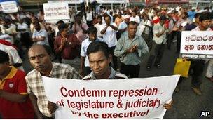 Opposition lawmakers and rights activists participate in a protest against the government in Colombo