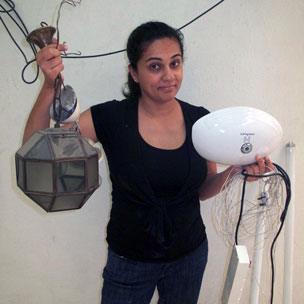 Anu Anand with light fittings