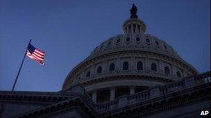 A US flag flies on the US Capitol, home to the Houses of Congress