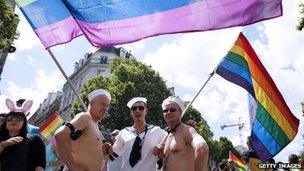 People parade during the 12th edition of Gay Pride in Paris