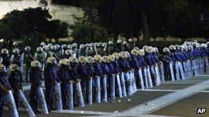 Greek riot police line up in front of parliament