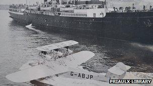 A seaplane and mail ship at St Peter Port Harbour in the 1930s