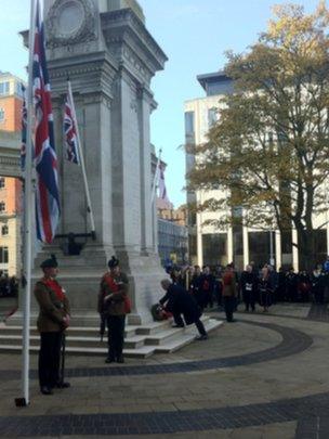 Eamon Gilmore laying a wreath in Belfast