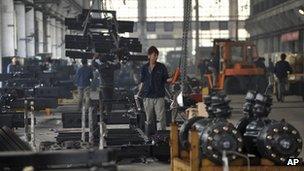 A worker at a bus manufacturer in Dandong City, Liaoning province, 20 October 2012