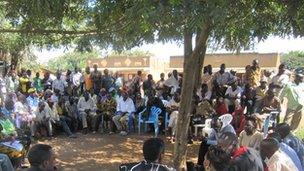 Kabaale village meeting about oil farm evictions