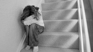 Child sitting on stairs