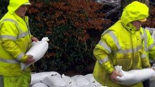 Men laying sand bags