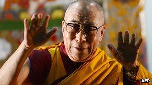 The Dalai Lama gestures prior to start a public teaching in Yokohama, Japan, 04 Nov 2012