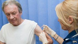 Man getting the seasonal flu jab