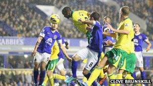 Sebastien Bassong heading the ball