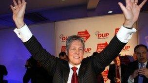 Peter Robinson accepts the applause following his speech at the DUP conference on Saturday